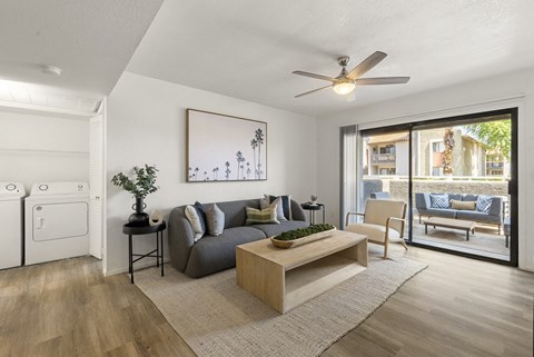 the living room of an apartment with a couch and a coffee table